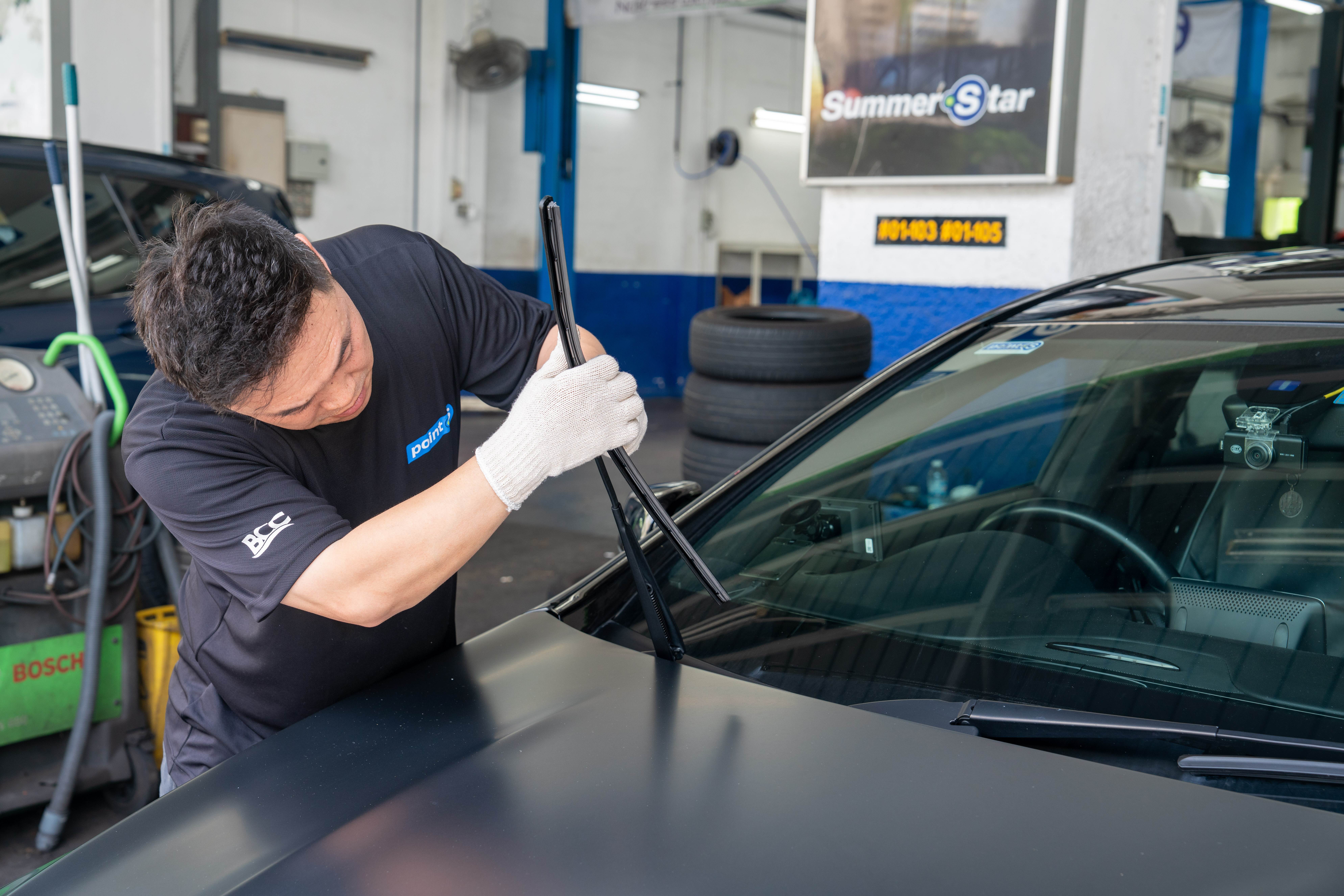 Technician installing Si-Plus wiper blade