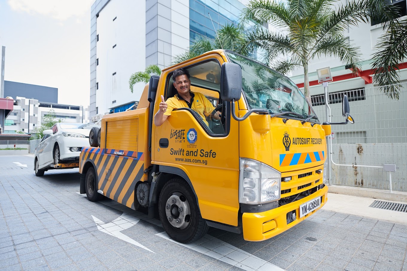 Professional towing truck providing emergency vehicle recovery services in Singapore